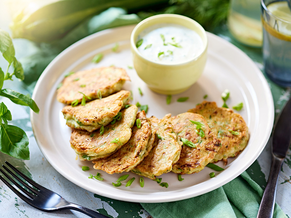 Zucchini fritters with yogurt-herb sauce
